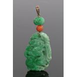 Chinese jade pendant, carved as a dragon and koi, with a coral bead and jade bead, with four round