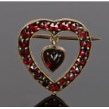 Garnet set brooch, in the form of a heart and a hart pendant to the centre, 21mm diameter