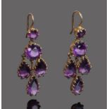 Pair amethyst earrings, with a round cut amethyst above three pear cut drops, 37mm long