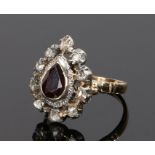 19th Century garnet and diamond set ring, the central pear cut garnet with a rose cut diamond