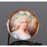 Late 19th Century enamel portrait brooch, with a lady wearing a feather hat and blue dress, 25mm
