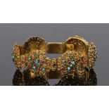 Victorian gemstone set bracelet, with six bosses with foliate design set with turquoise, rubies,