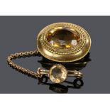 Victorian citrine set brooch, with an oval facetted citrine within a bead and edge, with an attached