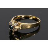 18 carat gold sapphire and diamond set ring, with a central sapphire and diamonds to flower head