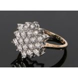 9 carat gold diamond set ring, the flower head ring set with nineteen round cut diamonds to illusion