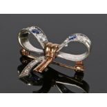 Sapphire and diamond bow brooch, with white and yellow gold, set with two sapphires and eight