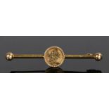 Chinese 14 carat gold brooch, with character marks to the centre and a bar back, 3 grams, 63mm long