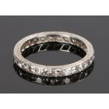 Diamond set eternity ring, in white metal with round cut diamonds to the shank, ring size K