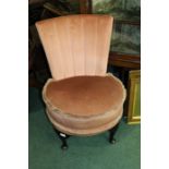 Mid 20th Century nursing chair upholstered in a puce tasselled edge material, on cabriole leg