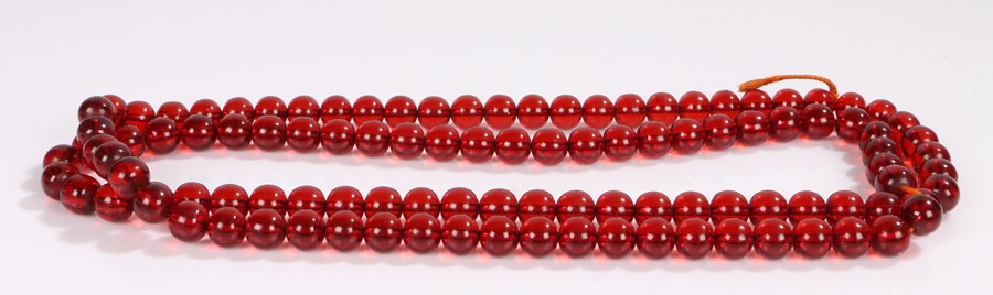 Bakelite bead necklace, in red, 147cm long