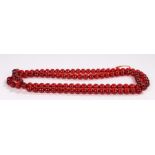 Bakelite bead necklace, in red, 147cm long