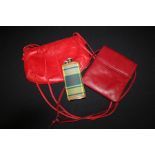 Two red leather handbags, tartan covered hip flask (3)