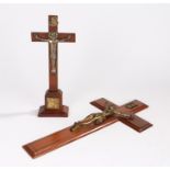 Two crucifixes, the first with a gilt metal Christ to the rosewood cross, 45cm high, the second on