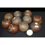 Ten lignum vitae bowling bowls, some with numbered ivory roundels, together with a jack (11)