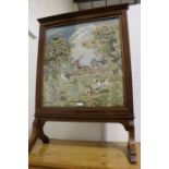 Victorian mahogany firescreen, with tapestry panel depicting a stag and hounds in a landscape, on