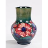 Moorcroft pottery vase, the plain neck above a bulbous body decorated with anemones, 21.5cm high