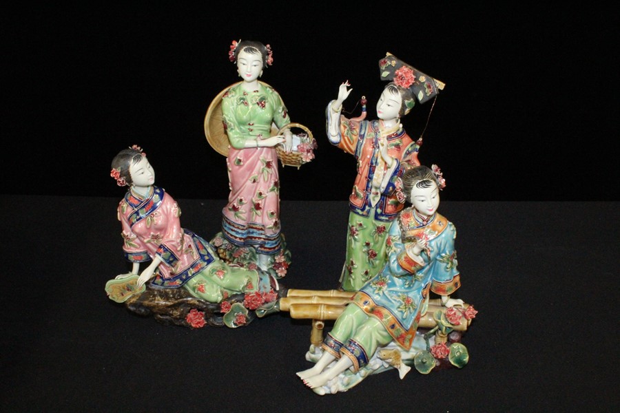 Four Oriental porcelain Geisha figures, in various poses, the tallest 30cm high, (4)