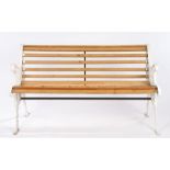 Cast iron garden bench, with scroll supports and central rosette with wooden slats, 125cm wide