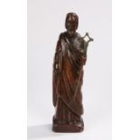 19th Century carved figure, of a bearded figure holding a stick on a plinth base, 35cm high