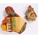 Bosson wall ornament depicting a gentleman playing a piano accordion, Bosson wall ornament depicting