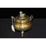 Chinese brass incense burner, surmounted by a dog of fo, 13cm wide