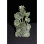 Chinese jadeite carved koi carp amongst water lilies, 15cm high