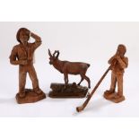 Black Forest carved stag, standing on a rocky plinth base, 14cm long, together with a further two