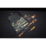Cased set of drawing instruments, three leather workers tools, Disney Snow White character stamps (