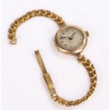 9 carat gold ladies wristwatch, with a gold plated strap