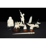 Six carved ivory figures, to include Buddha, Chinese junk, figure fishing, elephant, two small