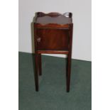 Georgian style mahogany pot cupboard, with square wavy galleried top above a cupboard door, on