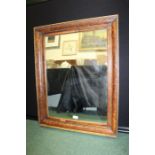 Burr wood framed wall mirror, with a rectangular mirror plate and cushion moulded frame, 59cm wide