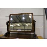 Victorian mahogany dressing table, with rectangular bevelled mirror plate, on scrolled supports,