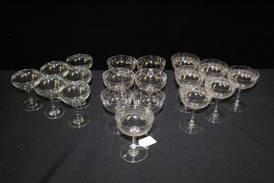 Collection of champagne saucers, to include a set of six zigzag decorated examples, a further set of