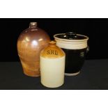 Stoneware bread crock and cover, two stoneware bottles, one with initials S.R.D. (3)