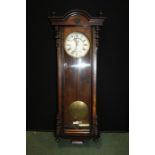 Farringdon regulator wall clock, the stylised foliate pediment above the signed white dial with