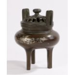 Japanese Meiji period bronze and silver inlaid koro, with pierced lid above the bulbous body