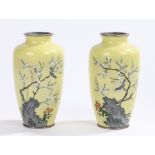 Pair of Japanese cloisonné vases, with a yellow ground decorated with a bird above a rocky base