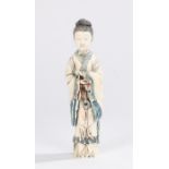 Japanese Meiji period ivory okimono, the standing figure with folding arms and long robes, with blue