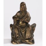 Japanese bronze statue, of a seated scholar holding a book and stroking his long beard, 23cm high