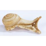 Japanese Meiji period bone netsuke, as a snail moving along a flower, 6.5cm