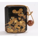 Japanese Meiji period four case inro, decorated in lacquer with gilt flowers heightened in mother of