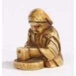 Japanese Meiji period ivory netsuke, of small proportions, of a seated figure, 2.5cm high