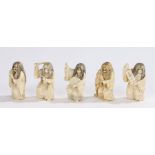 Collection of Meiji period ivory netsukes, with female heads swivelling to Japanese mythical