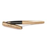 9 carat gold Parker fountain pen, with an engine turned case and vacant cartouche