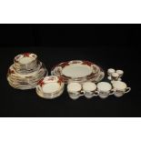 Sampson & Son ltd. porcelain tea and dinner service, the burgundy borders with gilt foliate