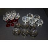 Six smoked glass dessert dishes, together with five etched glass dessert dishes, and five wine