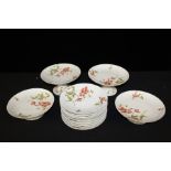 Rendon Limoges dessert service, with four stands/tazza and nine plates decorated with a foliate