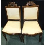 Pair of French beech bedroom chairs, with pierced carved cresting rails, watered silk upholstered