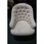 Victorian style armchair, with cream upholstered button back and seat, raised on turned legs and